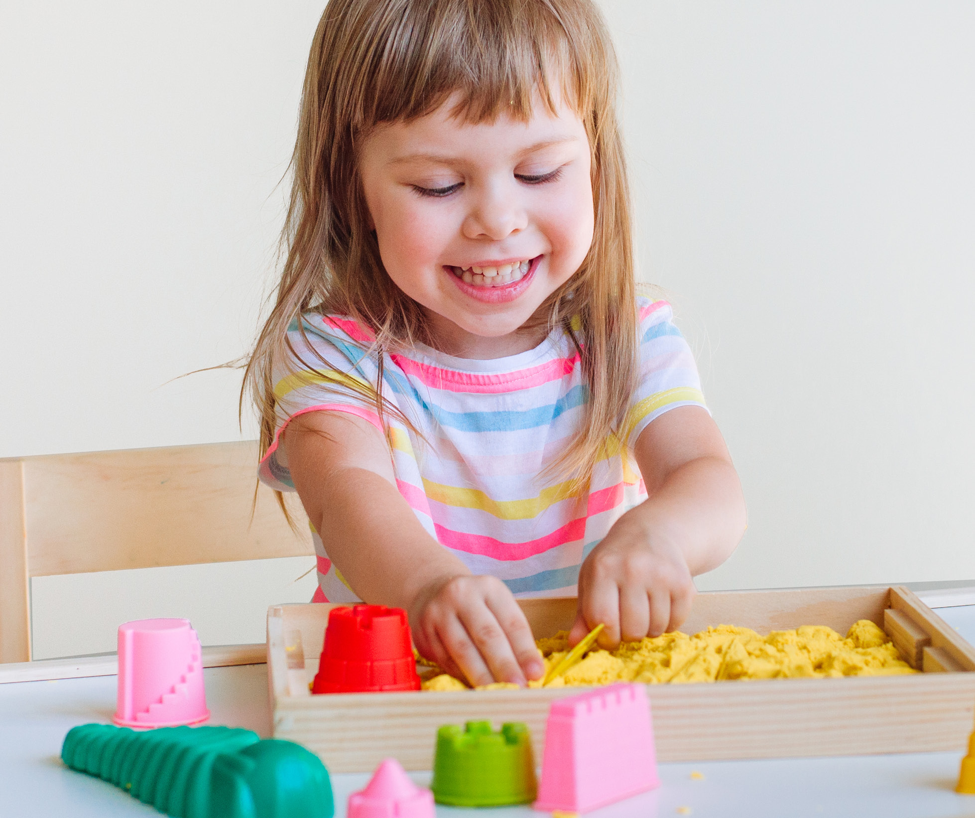 Image of little girl playing with sand
