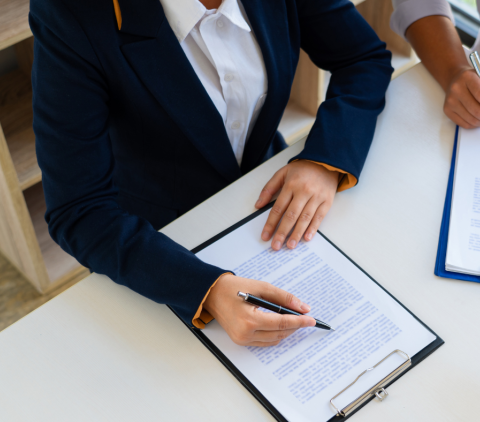 person signing a contract