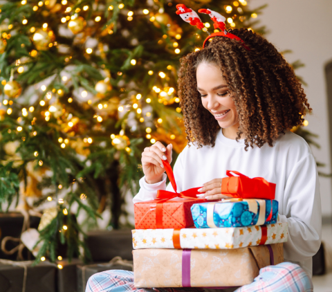 Lady with wrapped presents on her lap