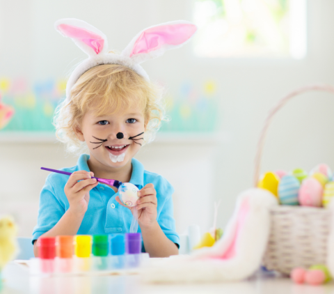 kid with easter craft