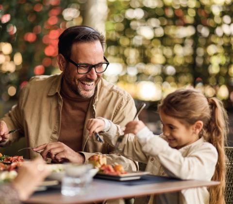 Dad and Daughter eating alfresco