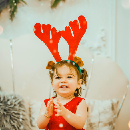 Little girl with reindeer ears