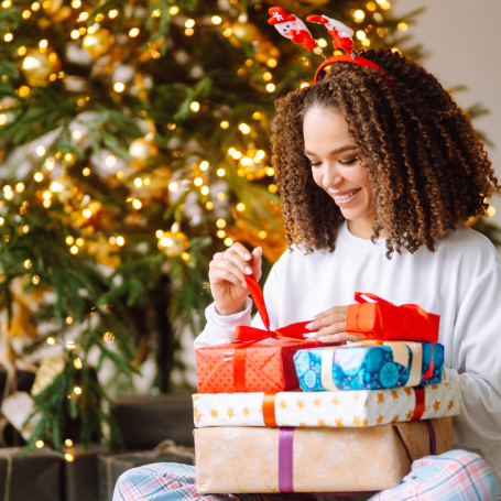 Lady with wrapped presents on her lap