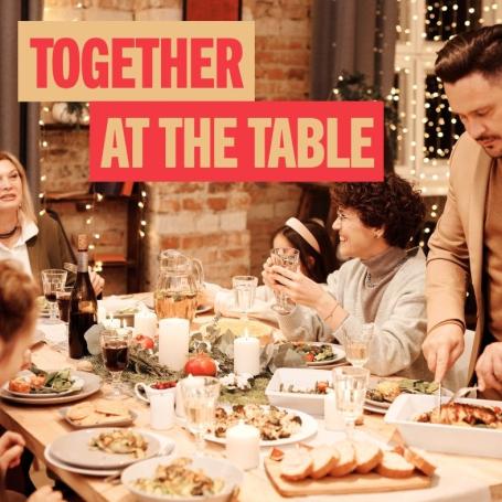 A family eating a feast at the dinner table