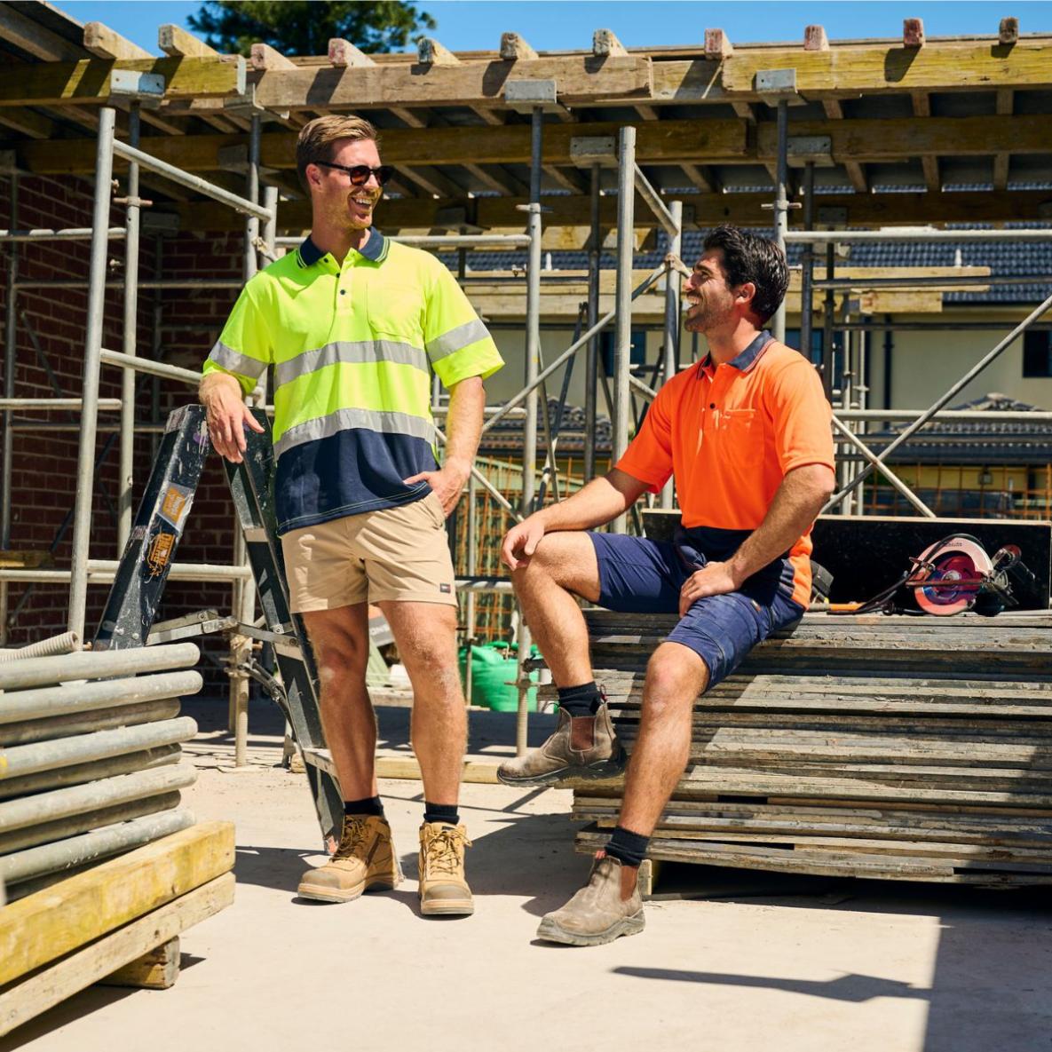 Men in workwear on worksite