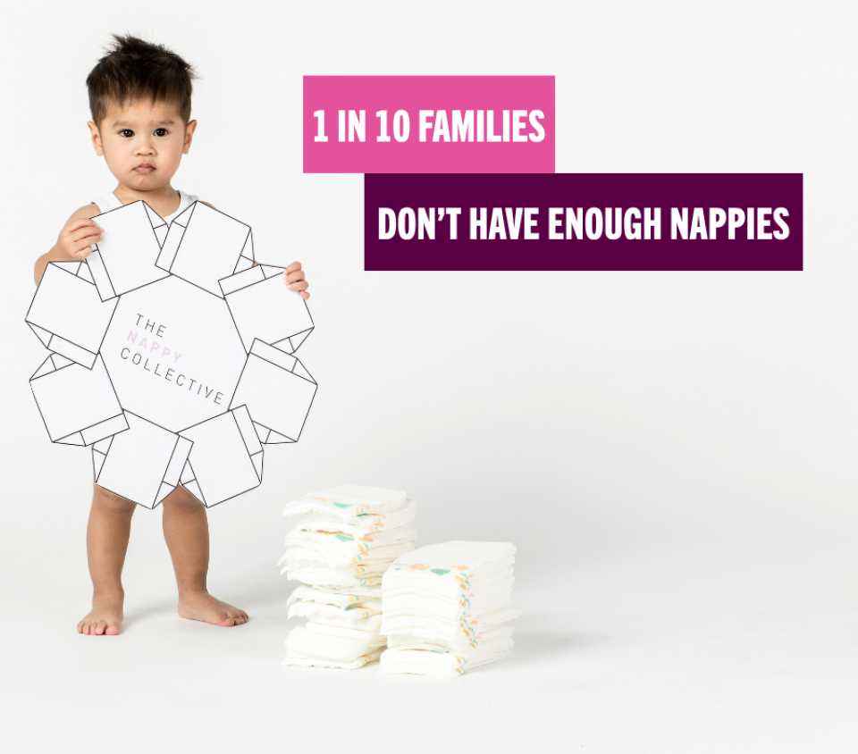 Little boy holding nappies